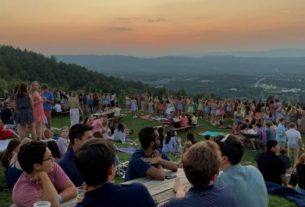 People enjoying the sunset at Carter Mountain.