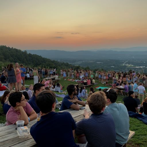 People enjoying the sunset at Carter Mountain.