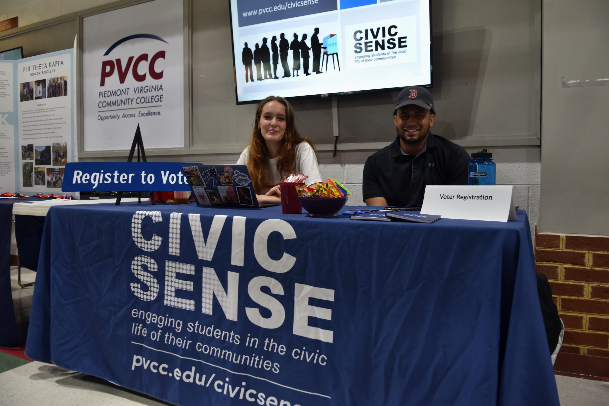 Students at PVCC encouraging other students to register to vote by providing laptops.