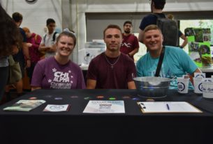 Lindsey Stengang, Will Lewis, and Christopher Cole Chi recruiting students for the Alpha Fellowship Club