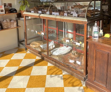 Display case with bread and pastries at Cou Cou Rachou.
