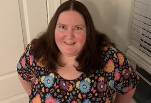 Dr. Tamara Whyte posing for the camera with a colorful flower print shirt on.