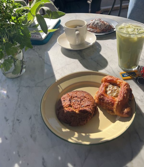 Table at Cou Cou Rachou with croissant aux amandes (behind), miso chocolate chip cookie, croissant aux oignons and iced matcha (left to right).