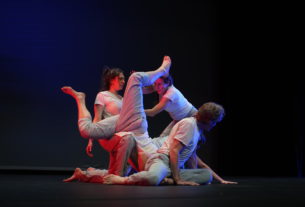 performers contorted together on the stage