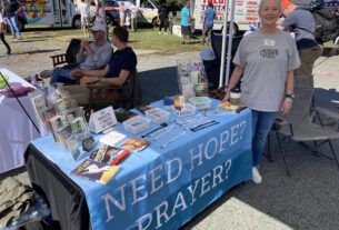 Terry Wood, teacher at Fluvanna County High School, at her tent for "offering hope through Christ."