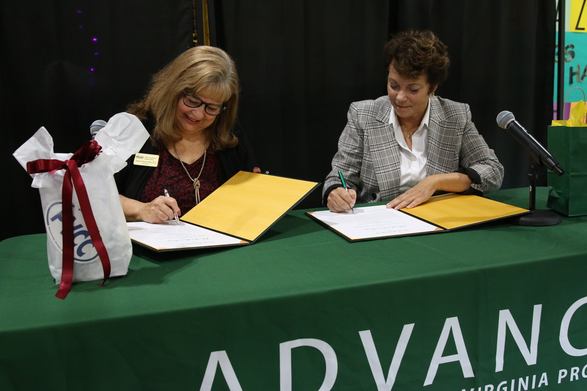 Dr. Muir and Dr. Runyon signing the ADVANCE program