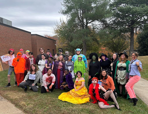 Dressed in a variety of costumes, PVCC students, faculty, and staff gather behind the main building for a group photo.