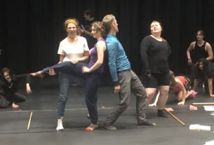 The cast practices choreography for the song "Sweet Transvestite."