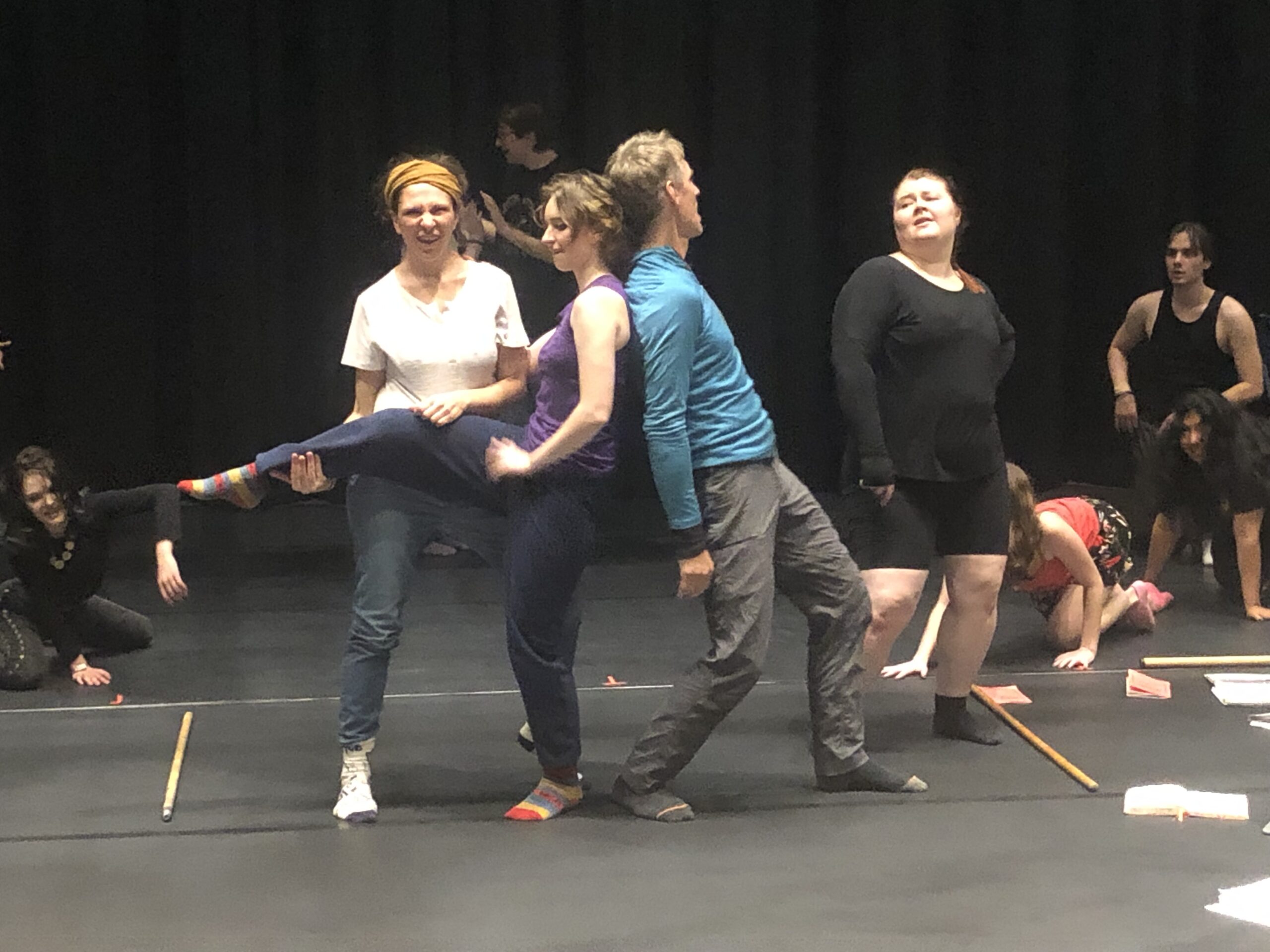 The cast practices choreography for the song "Sweet Transvestite."