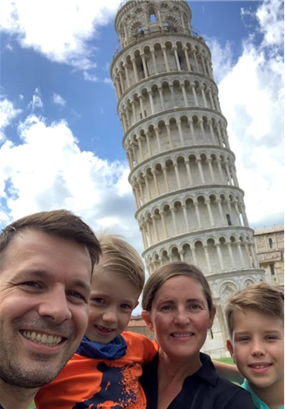 Anne Allison and her family pose in front of the leaning Tower of Pisa