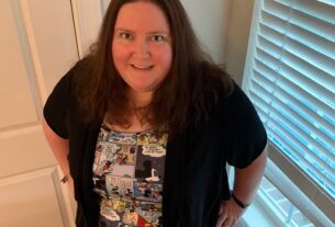 A photograph of Dr. Tamara Whyte wearing a dress decorated with Mickey Mouse comic strips.