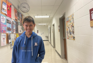 A student (Kritagya) smiles in a PVCC hallway