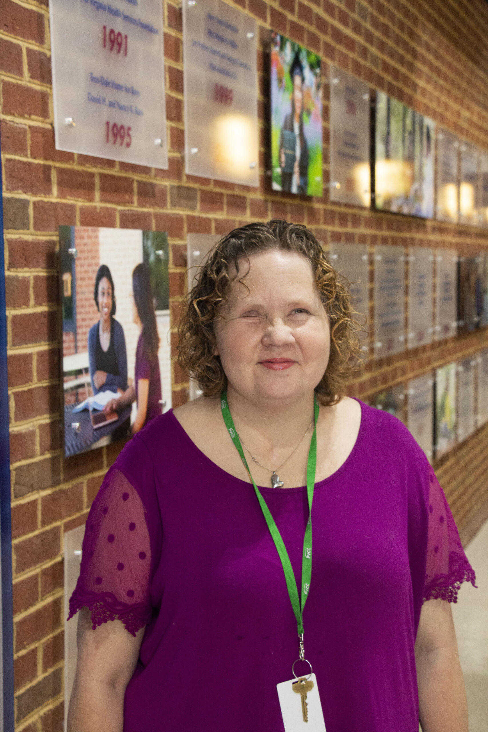 Sandra Bullins standing in a hallway of the main building.