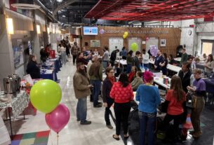 Various students represent their clubs at tables in the PVCC Woodrow Bolick Student Center.