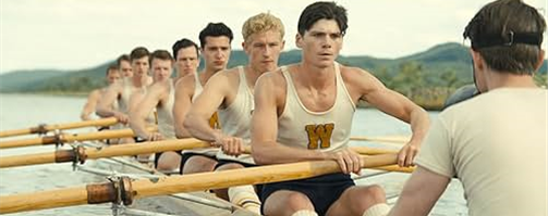 Male college students rowing their crew boat