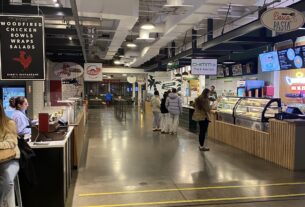 A hallway in the Dairy Market showing multiple restaurant bars.