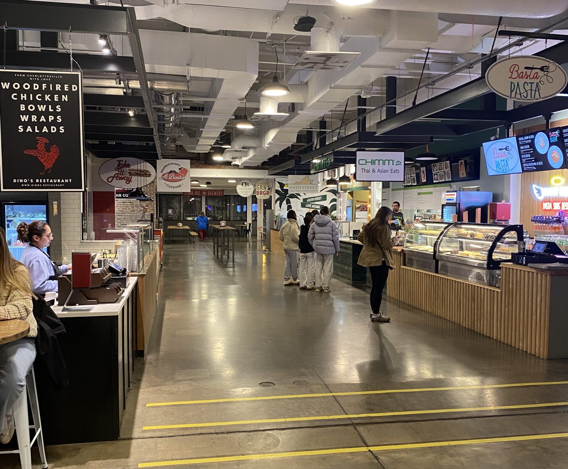 A hallway in the Dairy Market showing multiple restaurant bars.