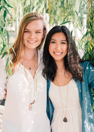 Two women looking into the camera.