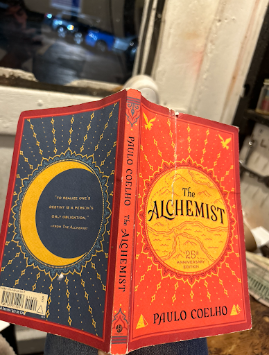 The front and back covers of the Alchemist, with art of the sun and moon respectively.