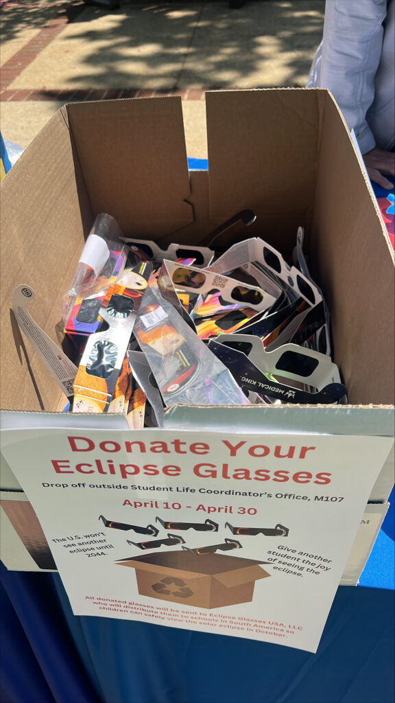 A donation box filled with no longer used eclipse glasses
