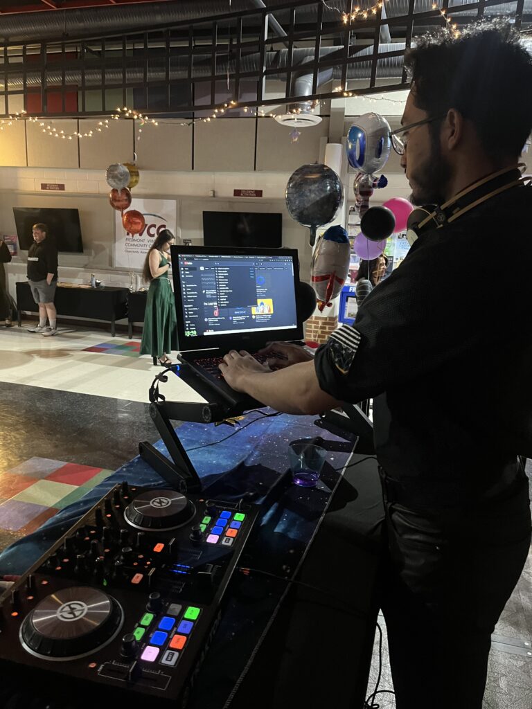 A disk jockey with his turntable setup.