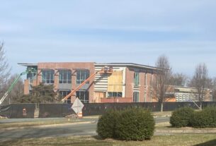 A view of construction on a large brick building