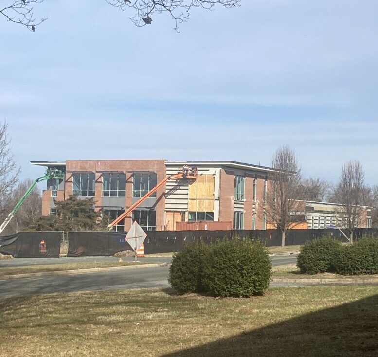 A view of construction on a large brick building