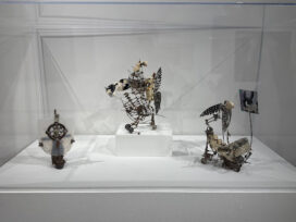 Aggie Zed’s sculptures: three small metal sculptures in a case.
