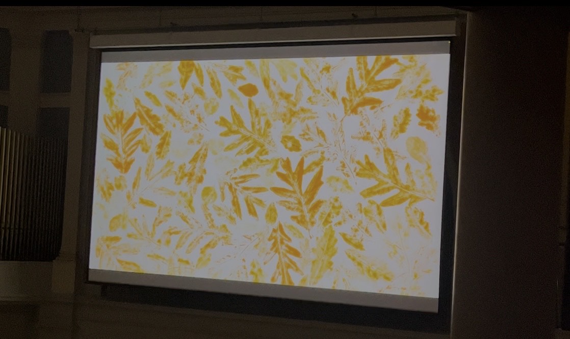A print of leaves done in yellow and light orange