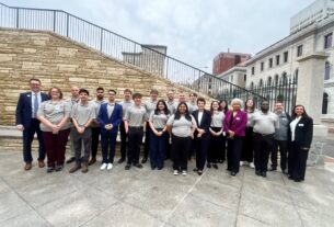 PVCC students, staff, and faculty pose for a picture together in matching PVCC shirts outside of the Virginia General Assembly in Richmond.