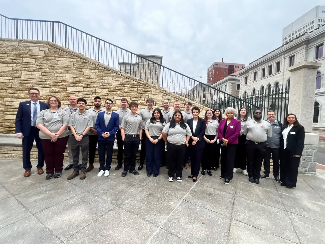 PVCC students, staff, and faculty pose for a picture together in matching PVCC shirts outside of the Virginia General Assembly in Richmond.