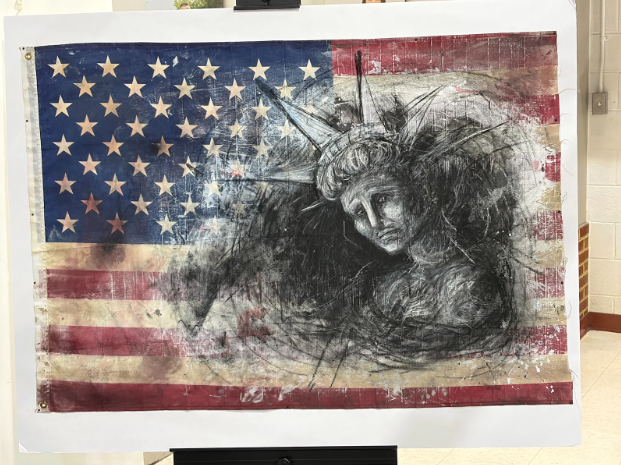 A mixed-media art piece depicting a miserable Statue of Liberty drawn with charcoal on a battered American flag.