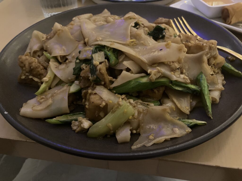 A plate of noodles and vegetables.
