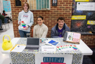 Professor Jennifer Koster with members of the creative writing club, Caroline Kenney (L) and Michael Gauss.