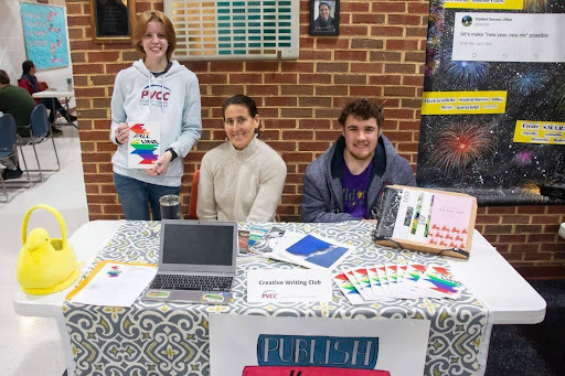 Professor Jennifer Koster with members of the creative writing club, Caroline Kenney (L) and Michael Gauss.