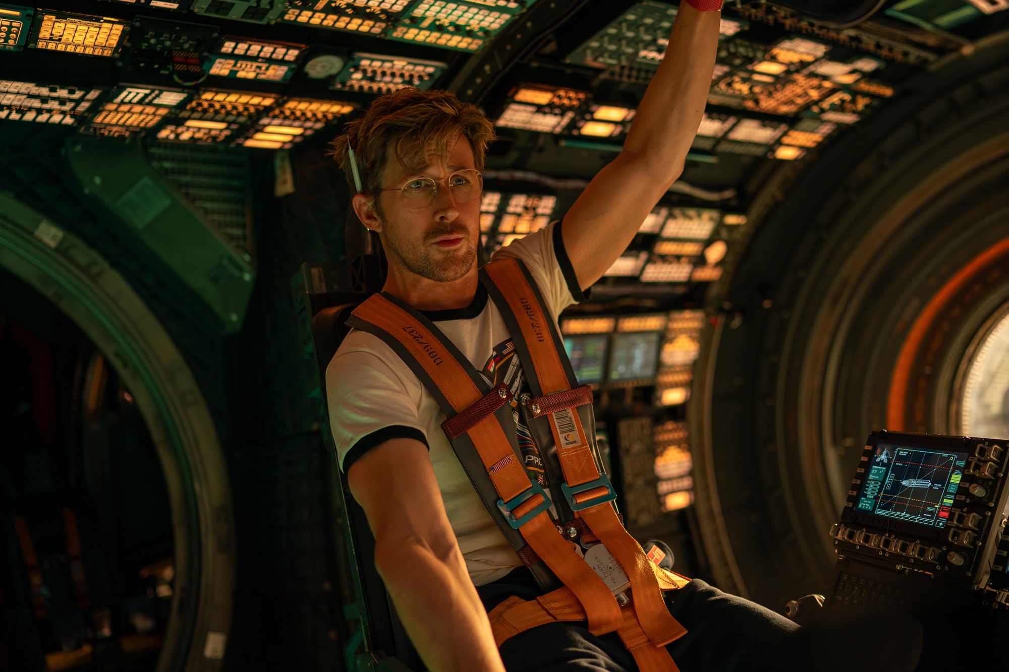 Ryan Gosling as his character Ryland Grace sitting in the pilot seat of the ship, The Hail Mary.